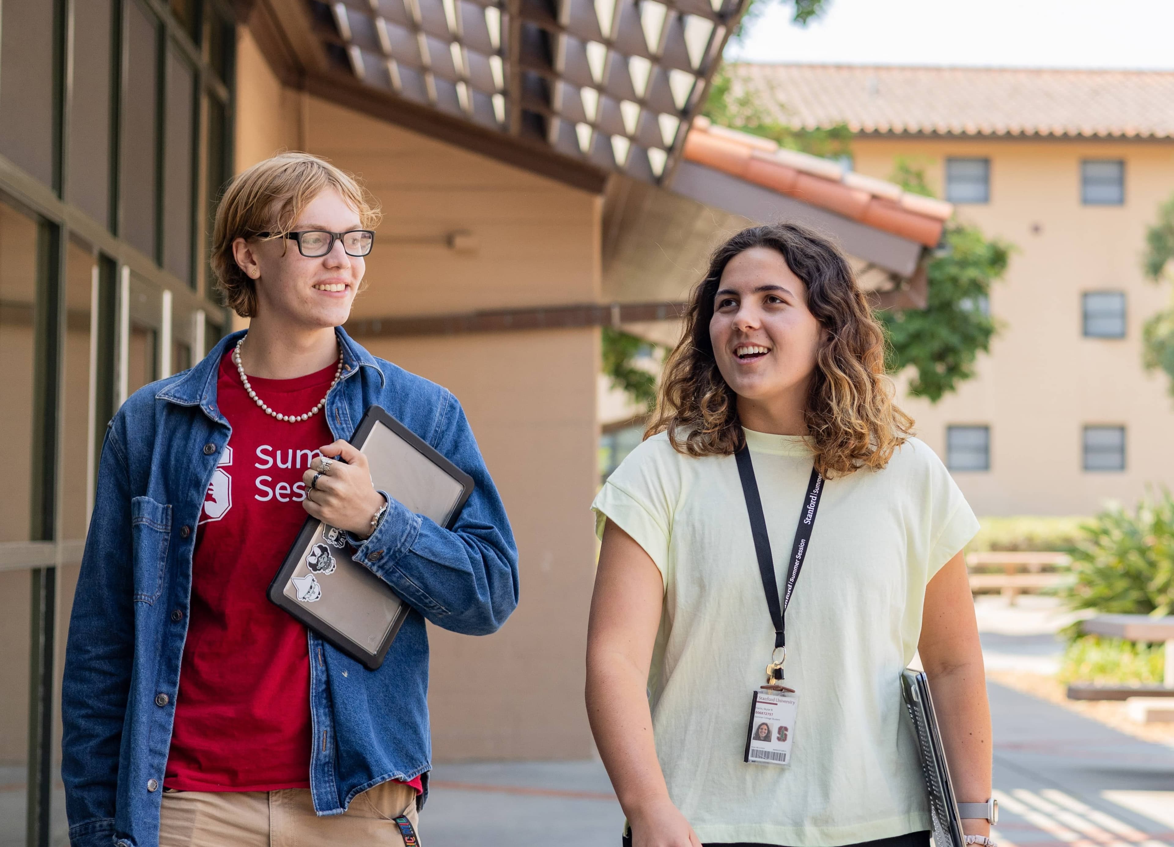 Two students walk outside talking. (Photo credits to Cayden Gu/Ethography for Stanford Summer Session)